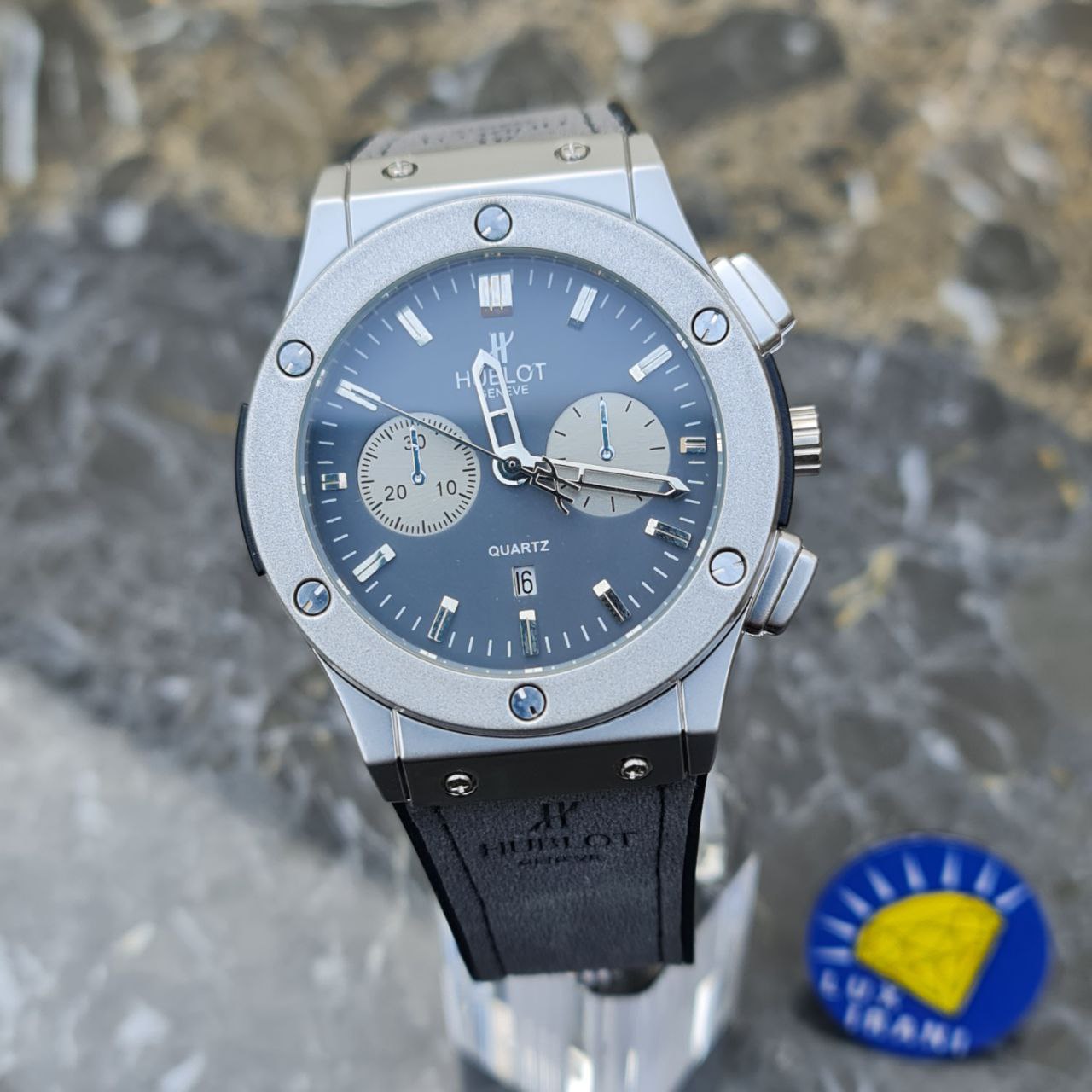 ساعت مردانله هابلوت کد 5559 بند طوسی قاب نقره ای صفحه طوسی